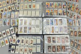 A CIGARETTE CARD COLLECTION, in three ring binder albums featuring a Will's card album and an
