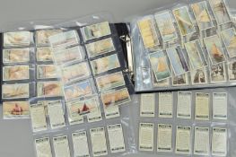 AN OGDEN'S CIGARETTE CARD ALBUM, featuring a number of highly collectable cards including Yacht's