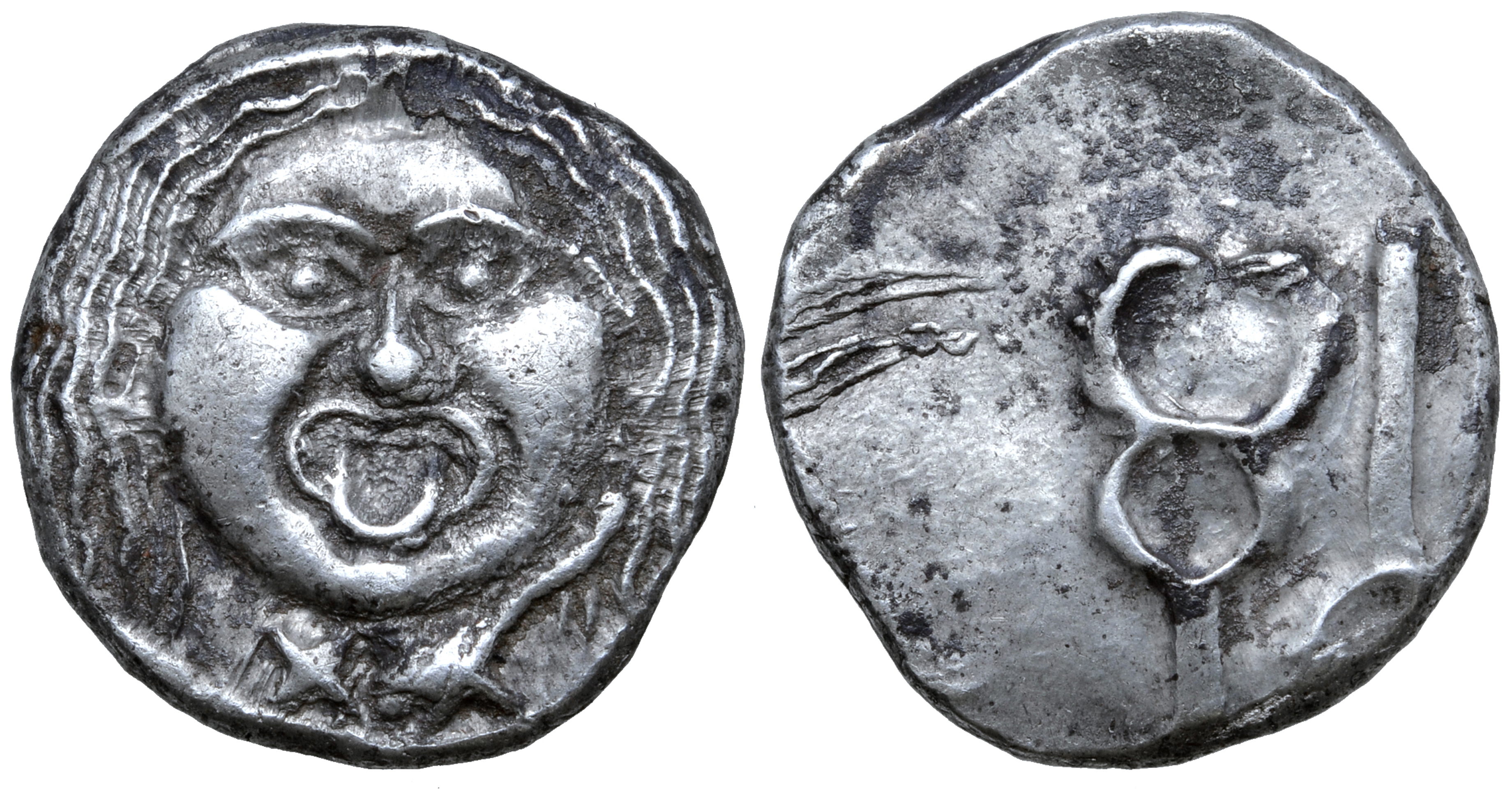 Etruria, Populonia AR 20 Asses. Circa 300-250 BC. Facing head of Metus, hair bound with diadem; X