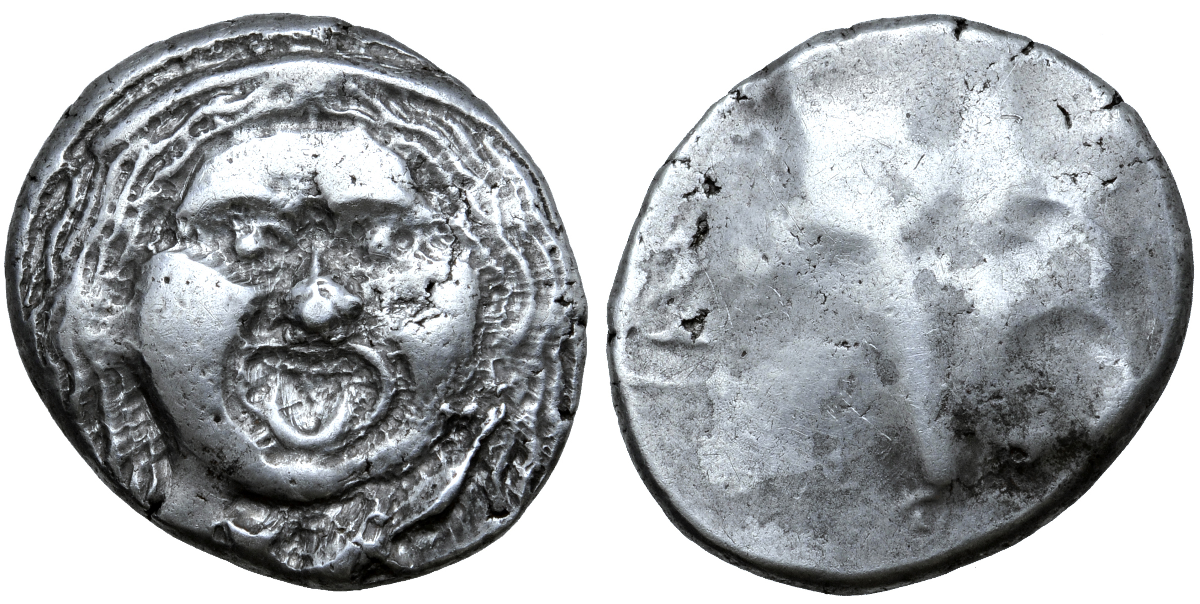 Etruria, Populonia AR 20 Asses. Circa 300-250 BC. Facing head of Metus, hair bound with diadem; X