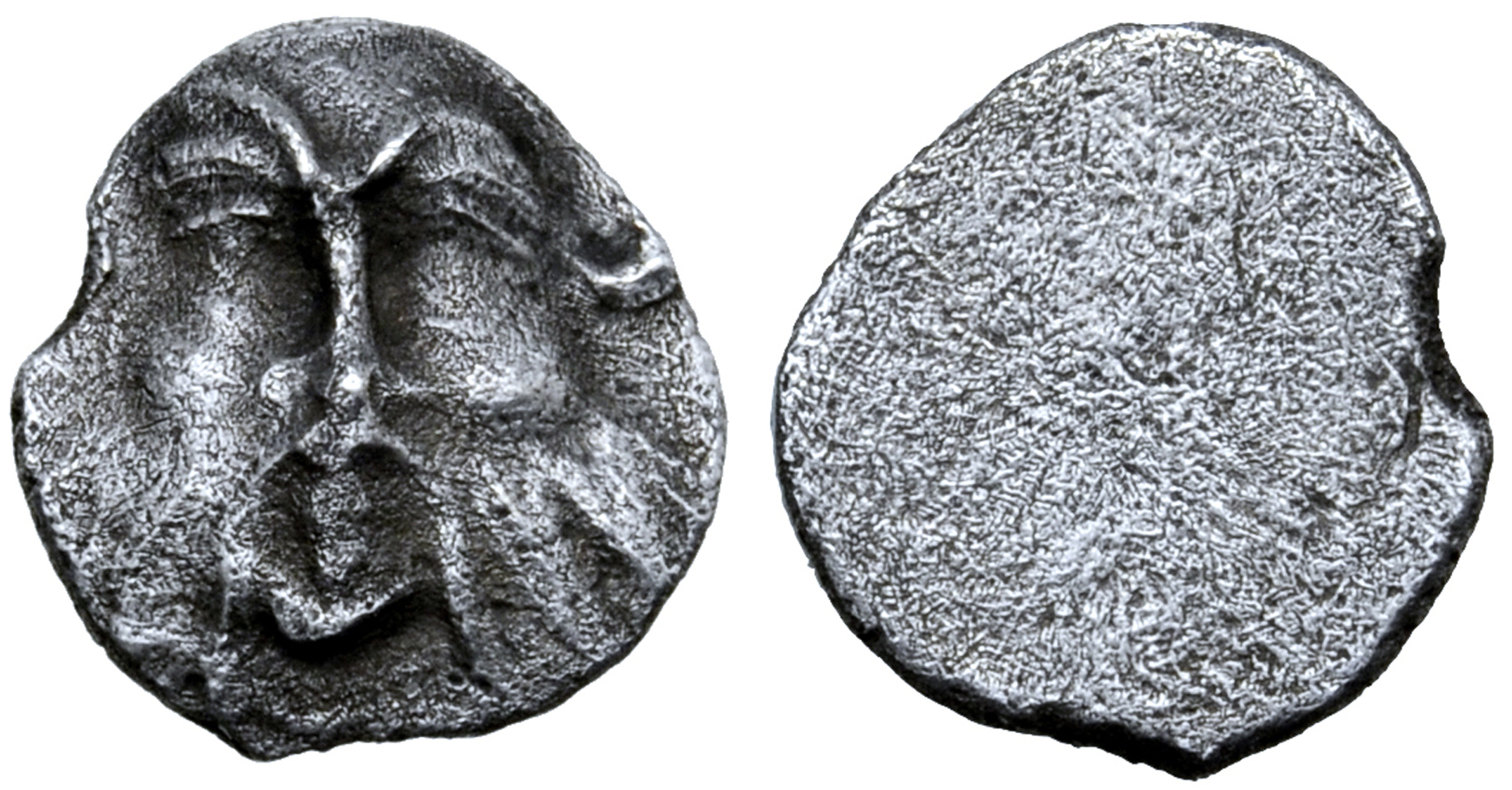 Etruria, Populonia AR Diobol (?). Late 4th - 3rd century BC. Head of Silenus facing / Blank. Cf.