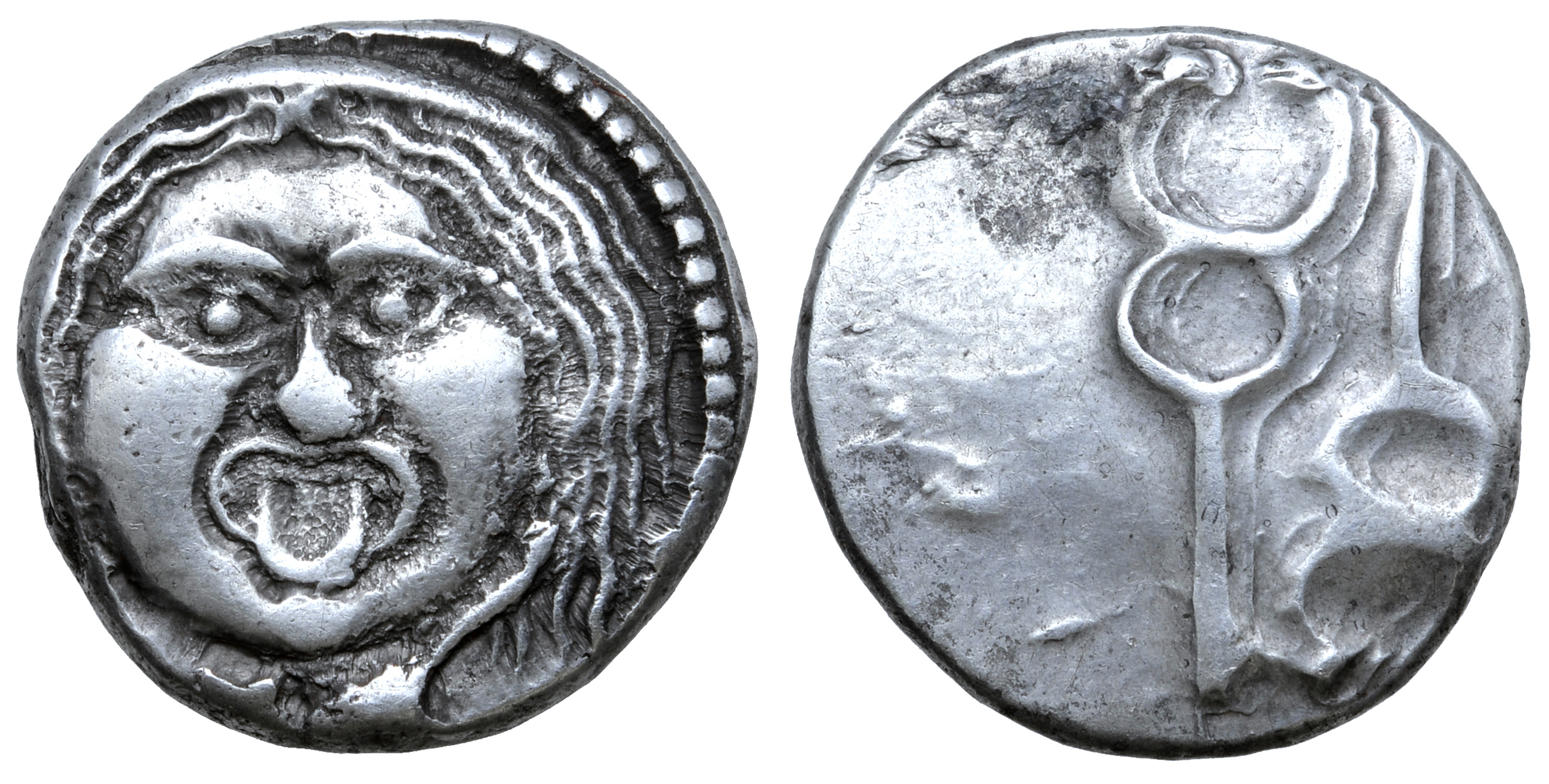 Etruria, Populonia AR 20 Asses. Circa 300-250 BC. Facing head of Metus, hair bound with diadem; X