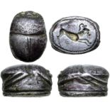 Etruscan Silver Scarab. Circa 5th century BC. Inlaid gold eyes; base engraved with leaping