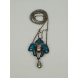 An Art Nouveau enamel and blister pearl pendantThe tri-lobed panel with blue and green translucent