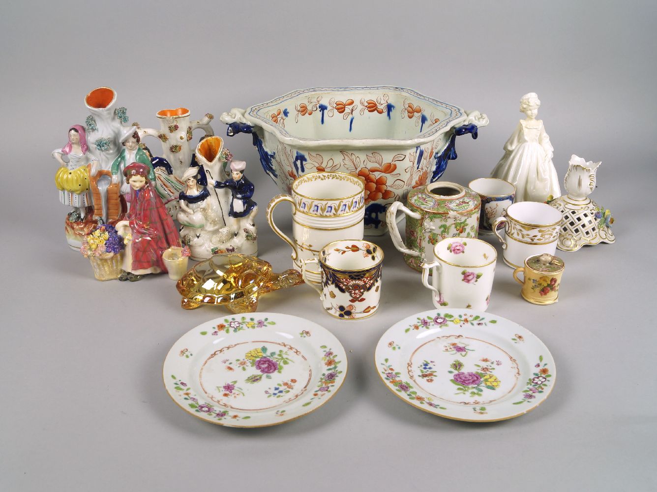 Three Staffordshire pottery spill vases, 19th century, each moulded with pairs of male and female