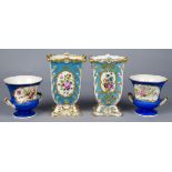A pair of Continental Sevres style square vases, late 19th century, decorated with reserves of