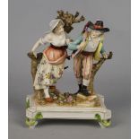 A Volkstadt porcelain figure group of a hunting man and his lady, early 20th century, modelled