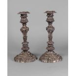 A pair of William IV silver candlesticks, Sheffield c.1831, J.F & Co., cast in the Rococo style,
