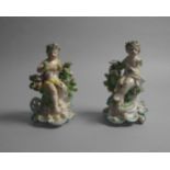 A pair of Chelsea Derby porcelain figural chamber sticks, 18th century, each modelled as draped