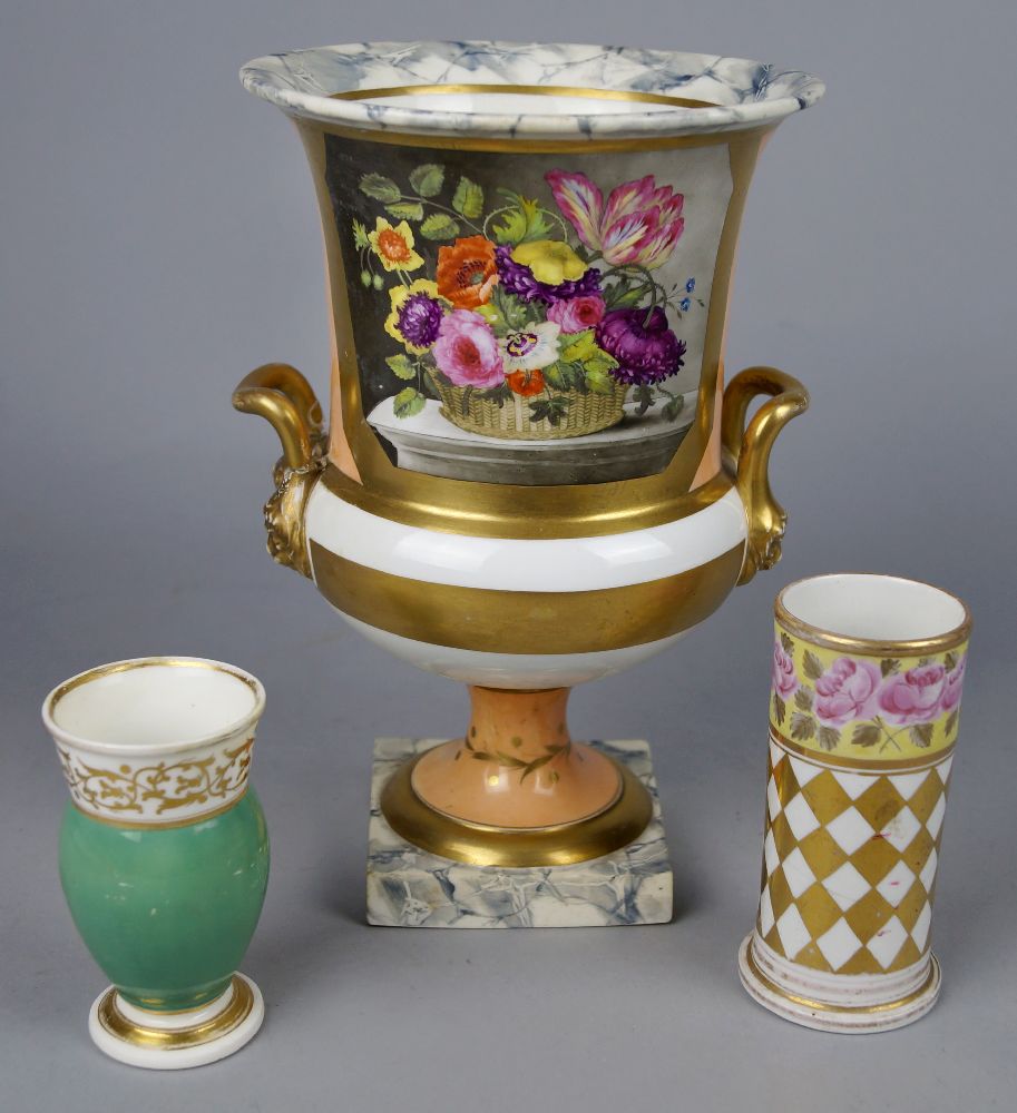 An English porcelain campana form vase, 19th century, with twin mask form handles, on a square