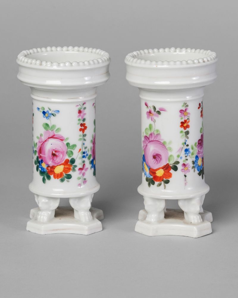 A pair of Continental porcelain spill vases, mid 19th century, with beaded rims, decorated with