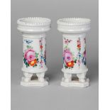 A pair of Continental porcelain spill vases, mid 19th century, with beaded rims, decorated with