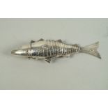 A Continental white metal spice box, in the form of an articulated fish, with hinged head, 14cm