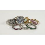 Including: a 9ct. gold, diamond and synthetic blue gem rectangular cluster half-hoop ring, an oval