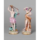 A pair of Continental porcelain figures of a male and female Bacchanalians, late 19th/early 20th