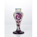 Gallé, a cameo glass vaseCirca 1910, signed in relief GalléOverlaid and acid-etched with flowers and