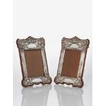 A Pair of Art Nouveau silver frames with oak backs and easel supports Mark of E.J. Trevitt and Sons,