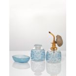 ‘Epines’, a Lalique clear and frosted glass with blue staining dressing/toilette part setDesigned