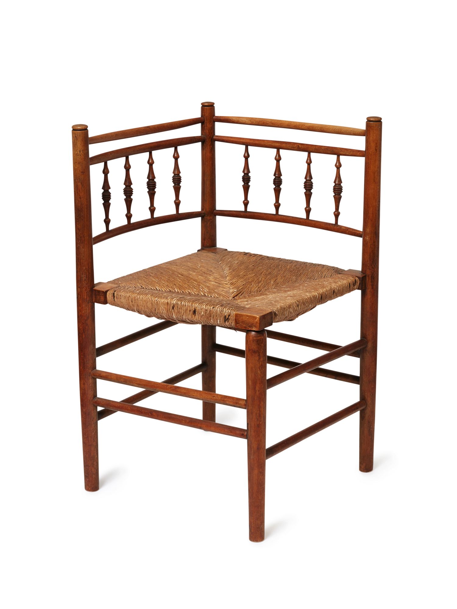 Morris & Co, a turned beech and sea-grass ‘Sussex’ corner ChairLate 19th CenturyTurned uprights