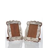 A Matched Pair of Art Nouveau silver frames with oak backs and easel supports Mark of William