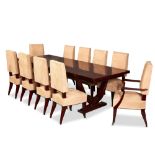 Dominique Attributed, a French Art Deco rosewood dining table and ten suede upholstered