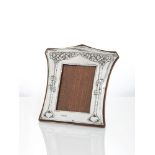 'For Auld Lang Syne', an Arts & Crafts silver photograph frame with oak back and easel supportMark