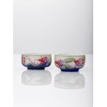 Daum, a pair of small acid-etched and enamelled 'fuchsia' glass saltsCirca 1910, signed in relief