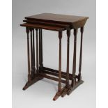 A Regency style nest of tables, 20th Century, the rectangular tops above turned tapering legs,