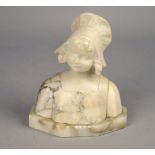 An alabaster bust of a smiling girl, early 20th century, wearing a bonnet, signed indistinctly to