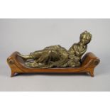 A bronze figure of a reclining young woman with a water jar, probably representing a water