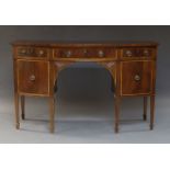 A Regency style mahogany and cross banded bow front sideboard, early 20th Century, with three frieze