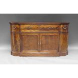 A George III mahogany and crossbanded breakfront secretaire cabinet, circa 1760, in the manner of
