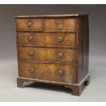 A George III mahogany chest of drawers, with two short over three long graduated drawers, raised