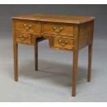 A George III oak four-drawer side table, on square tapering supports, 77cm wide, 70cm high