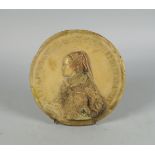 A composition stone roundel of Mary, Queen of Scots, modelled in profile, with a band of latin