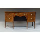 A George III mahogany, rosewood crossbanded and line inlaid, bowfront sideboard with three frieze