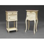 A French white painted and marble top bedside cabinet, 20th Century, the shaped top above carved