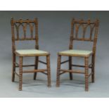 A pair of oak bobbin turned Gothic side chairs, 19th century, with gingham upholstered seats (2)