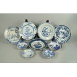 A Chinese blue and white porcelain plate, Kangxi, painted with a basket of flowers, 21.5cm diameter,