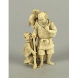 A Japanese model of a hunter and his son, late 19th/early 20th century, the man holding a rifle,