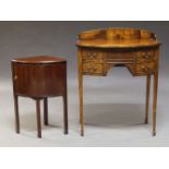 An Edwardian mahogany bow front dressing table, with shaped back above five drawers, raise on square