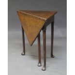 An oak drop-leaf corner table, late 18th century, on tapering legs to pad feet, 66cm high, 84cm