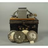 A film editors viewing machine and splicer, on a wooden base, 20th century, together with a tin