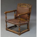 An oak metamorphic coffee table/chair, early 20th century, with padded back and seat, on stretchered