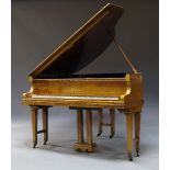 A walnut baby grand piano by R. Goetze, early 20th Century, 99cm high x 145cm wide x 124cm deep