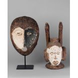 A Igbo tribal mask, portrayed with long horns, the mask with big ears and his face heightened with