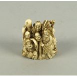 A Japanese figure group of sages and deities, signed to base, late 19th/early 20th century, 5.5cm