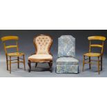A Victorian mahogany button back nursing chair, upholstered in cream and salmon damask pattern