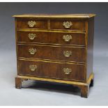 A George III style yew wood chest of drawers, late 20th Century, with two short over three long