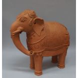 Two Indian pottery models of Nardi the bull and an elephant, 20th century, the elephant 76cm high